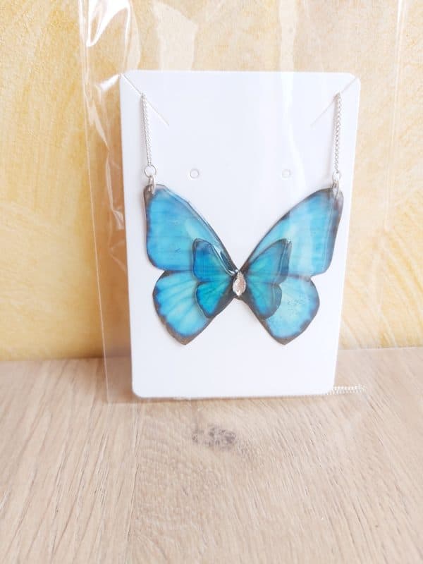 Double papillon bleu avec un strass de Swarovski